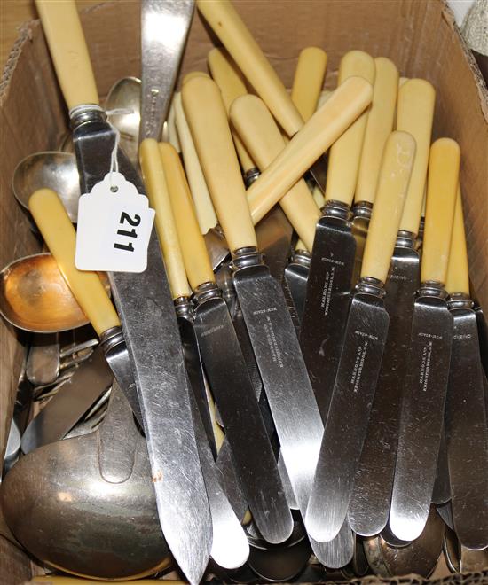 Eleven Harrods ivory handled table knives, seven dessert knives and a carving knife and assorted plated flatware.
